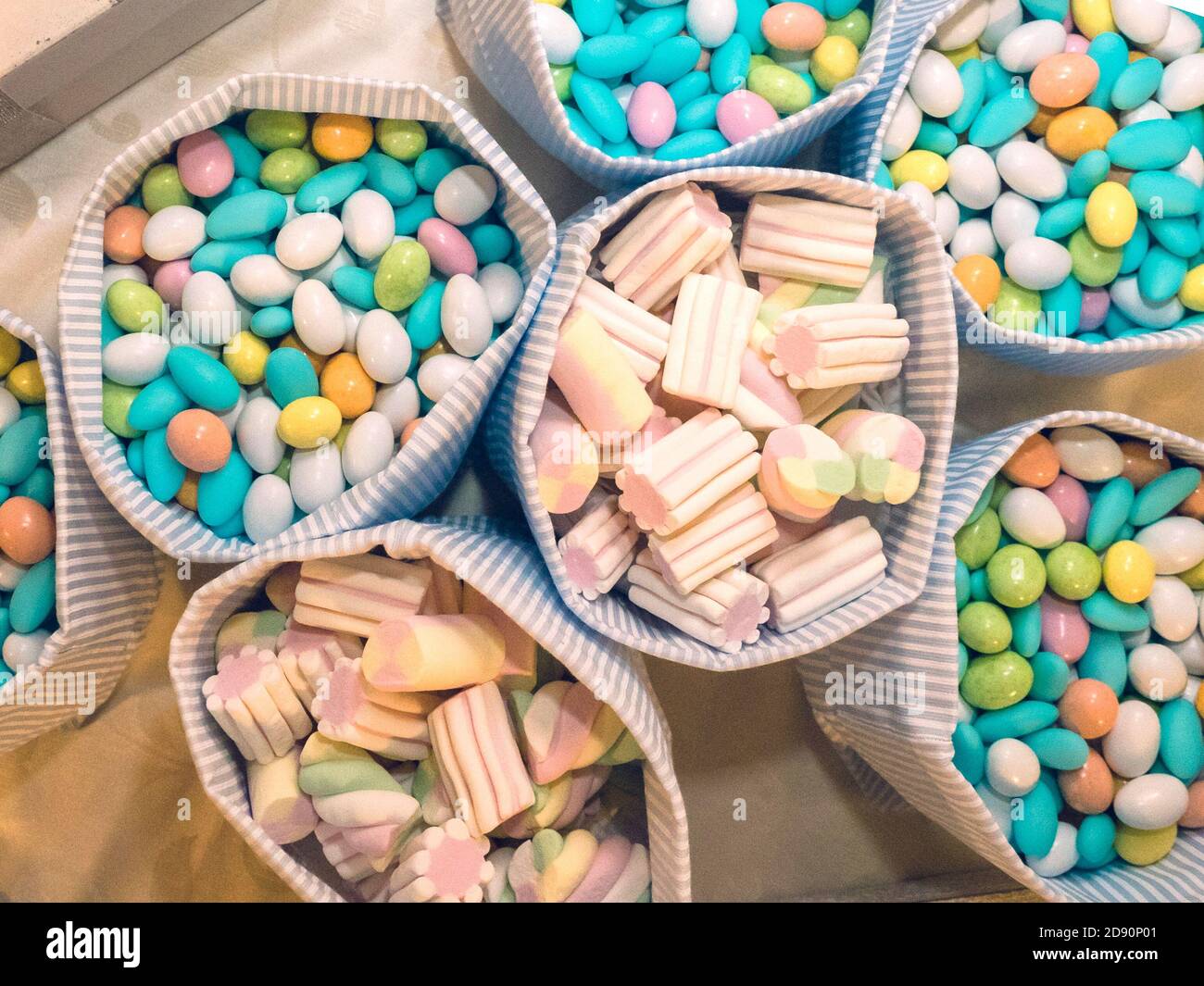 colored confetti and candy for baptism Stock Photo Alamy