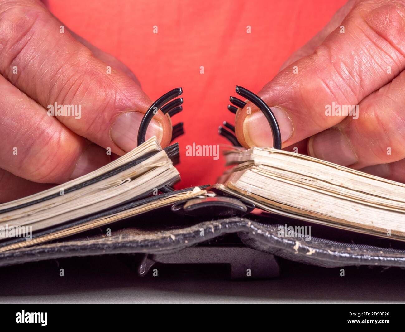 Closeup POV shot of a man’s hands opening or closing the rings of a