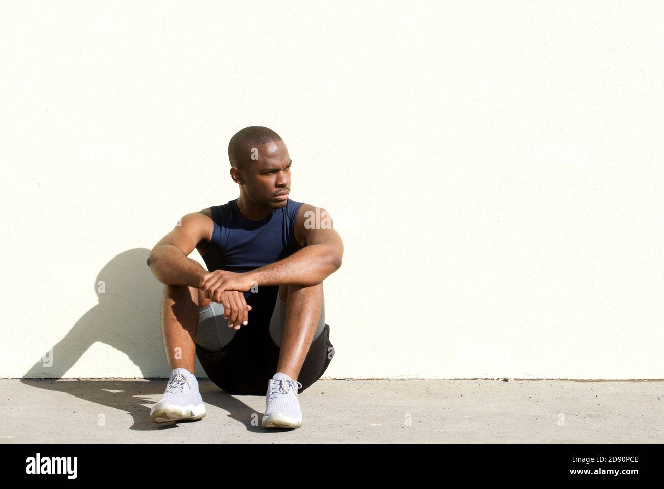 Young afro american man sitting hi-res stock photography and images - Alamy
