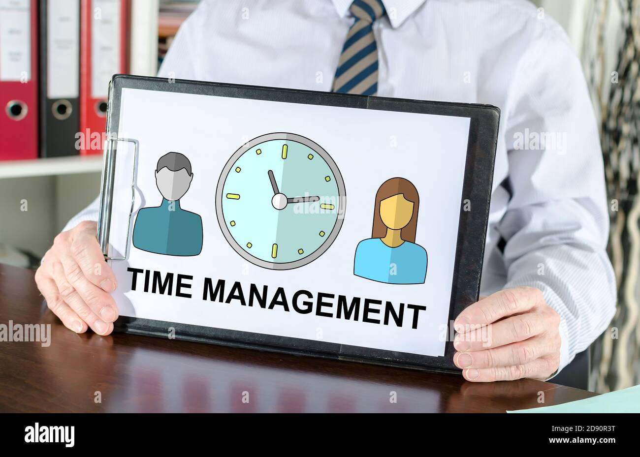 Time management concept shown by a businessman Stock Photo