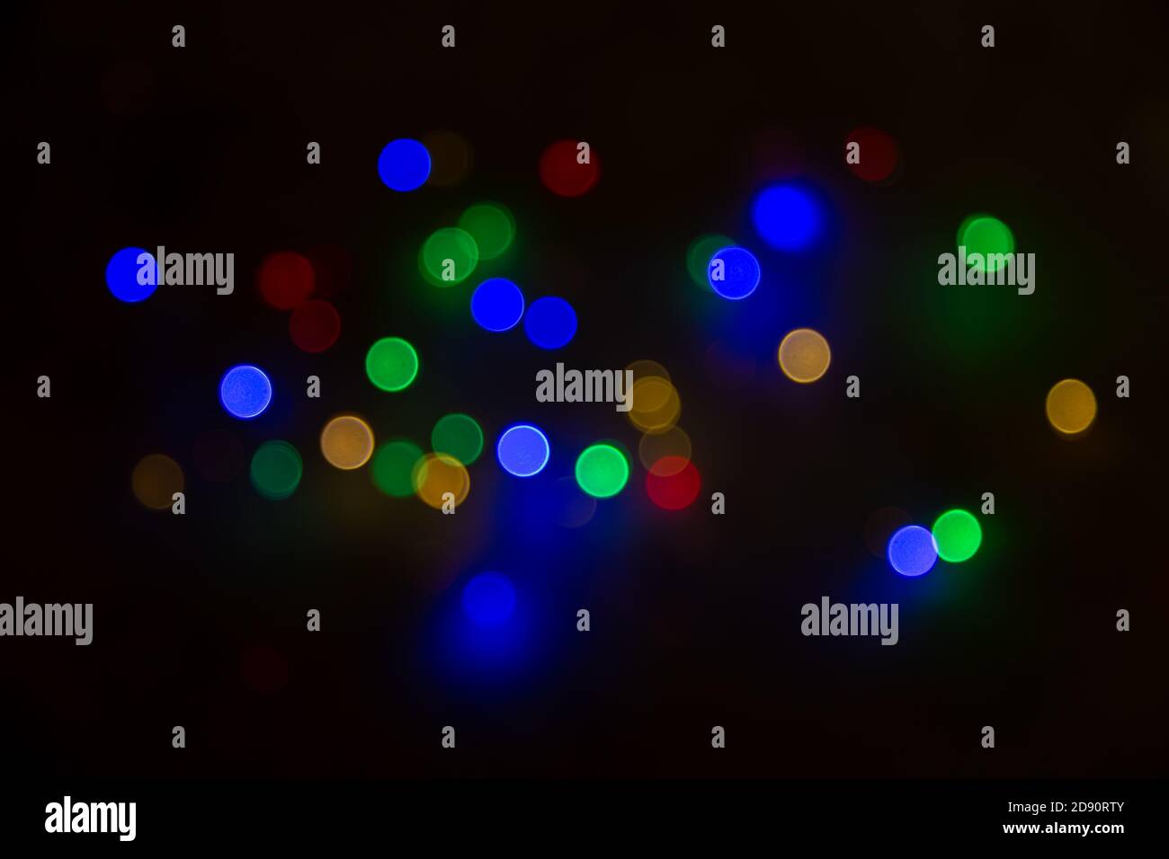 Abstract background, multicolored bokeh on a black background. Stock Photo