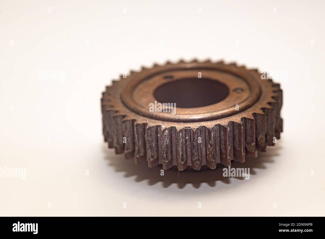 close up, part of the worn, broken teeth, faces of a plastic gear on a