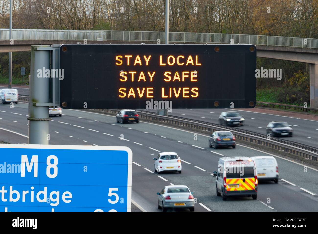 Glasgow,Scotland, UK. 2 November 2020. Motorists pass motorway gantry with Covid-19 health advisory message on the M8 in Glasgow as Scotland enters new Coronavirus lockdown regulations  with the central belt and Glasgow placed in Level 3. Iain Masterton/Alamy Live News Stock Photo