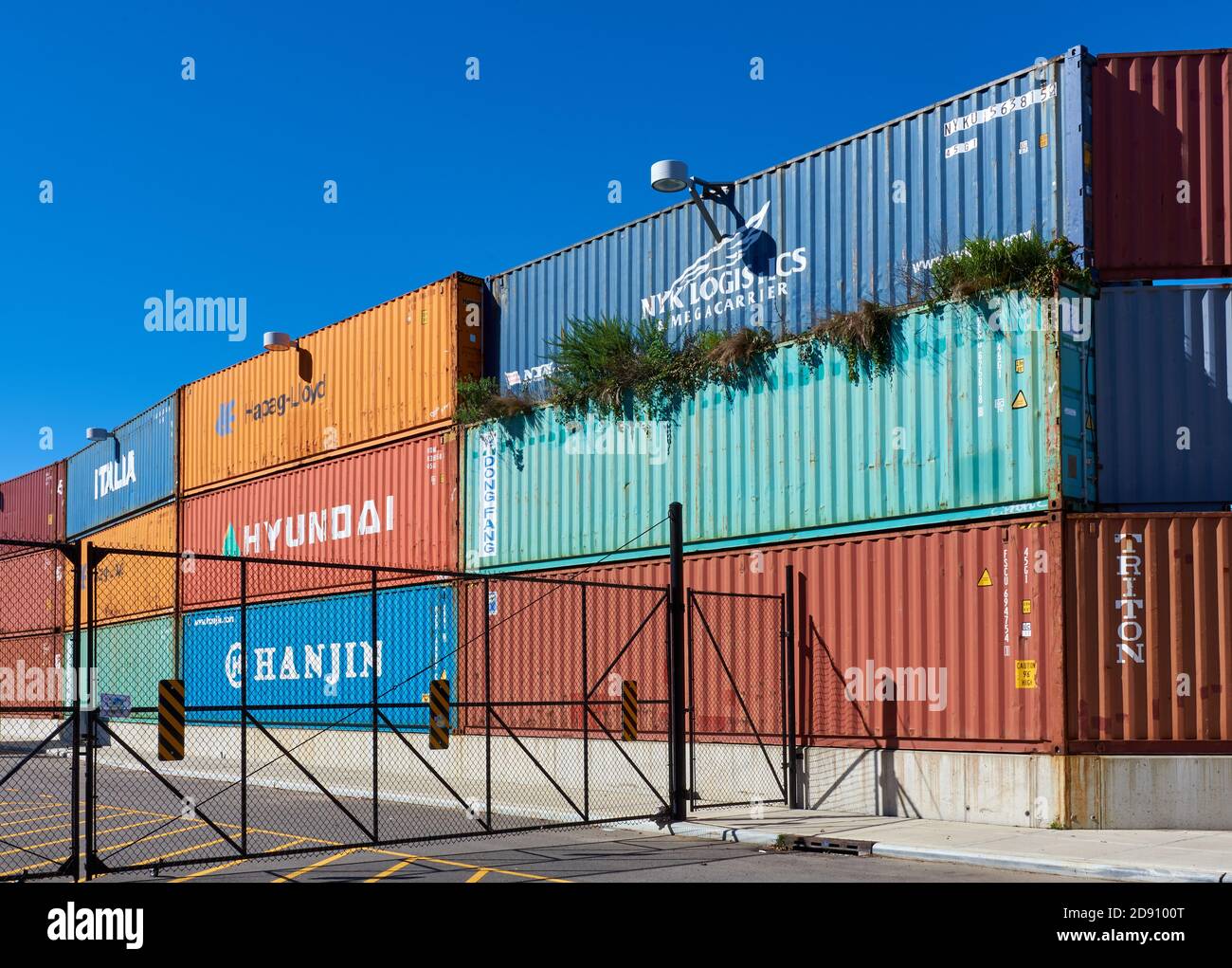 Colorfully painted shipping containers at the Kent Ave entrance to the Brooklyn Navy Yard adjacent to Steiner Studios. Stock Photo
