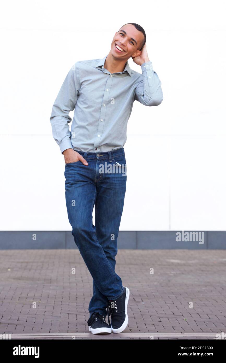 Smiling african man full body hi-res stock photography and images - Alamy