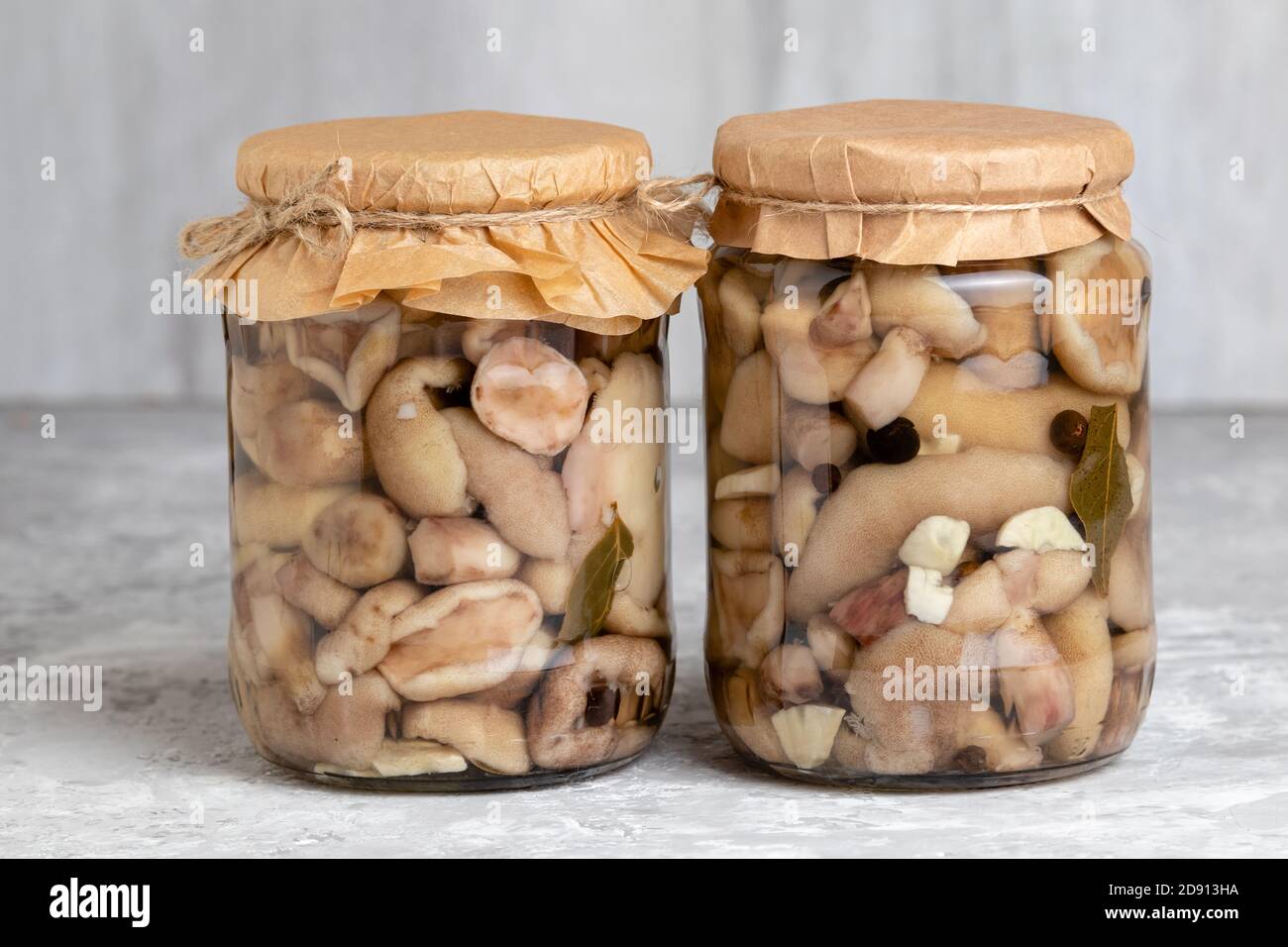 Canned forest mushrooms. Marinated mushroom in glass jar. Edible fungi