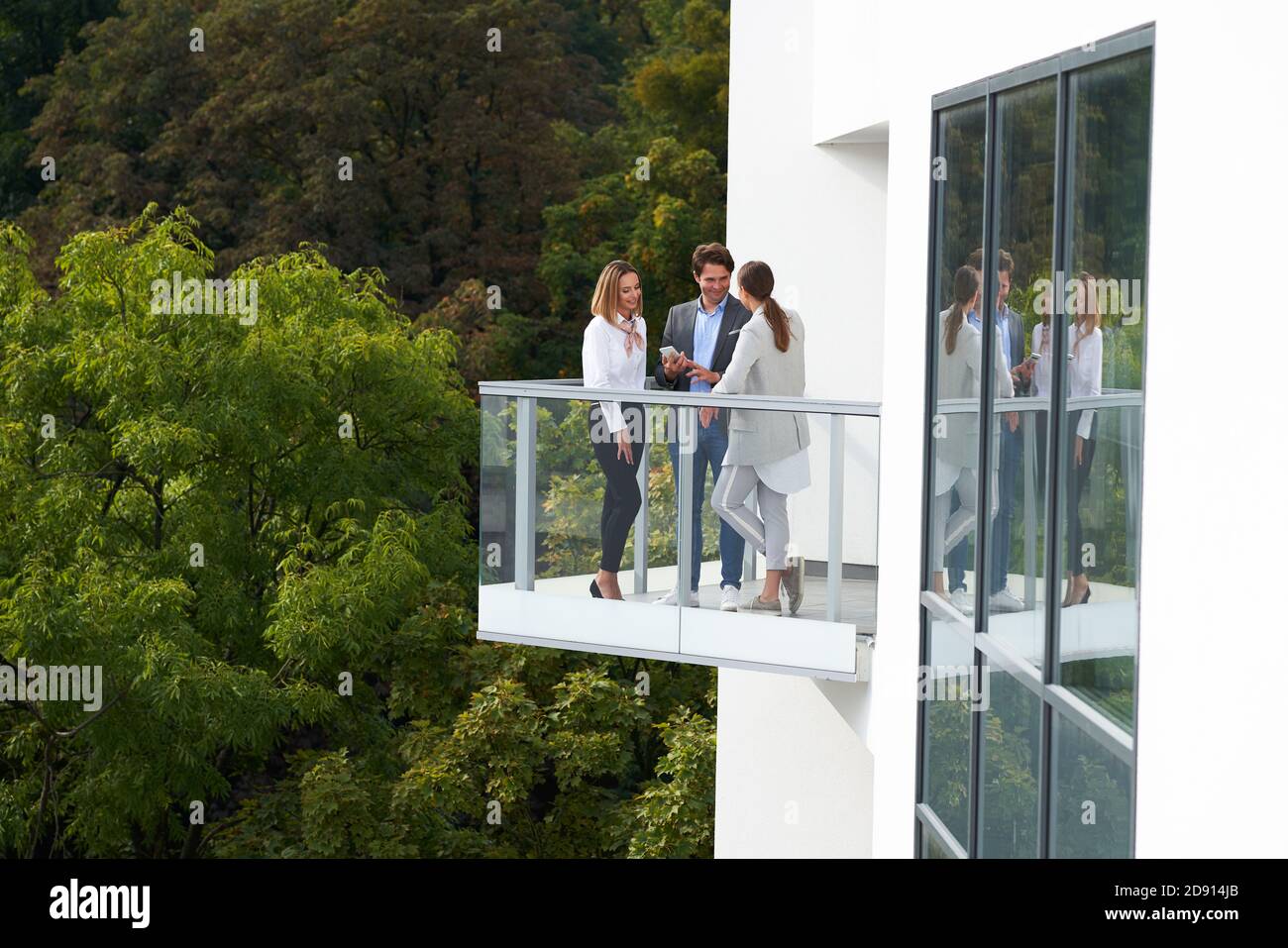 Team of businesspeople working discussing outdoors Stock Photo