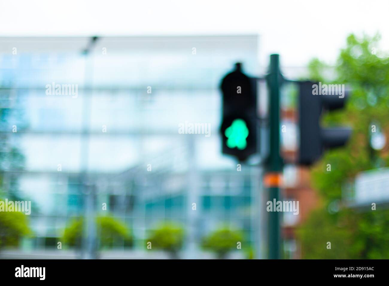 Pedestrian crossing traffic light with green man Stock Photo - Alamy