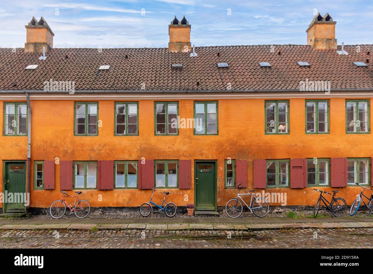 Copenhagen, Denmark - Historic yellow and orange coloured houses in the Nyboder neighborhood of Copenhagen, which was a former Naval di Stock Photo