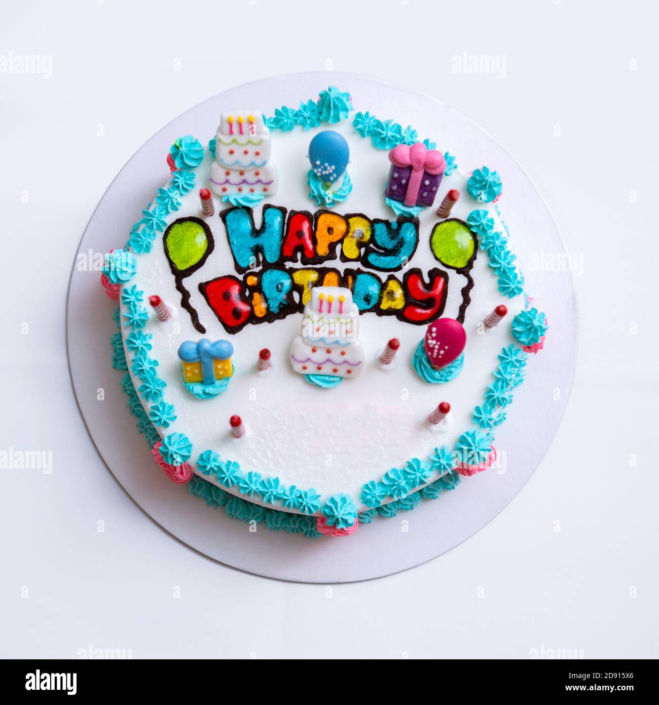 Birthday cake with candles isolated on white Stock Photo - Alamy