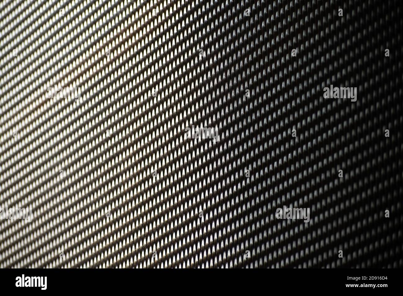 Metal mesh with regular pattern and shadow Stock Photo - Alamy