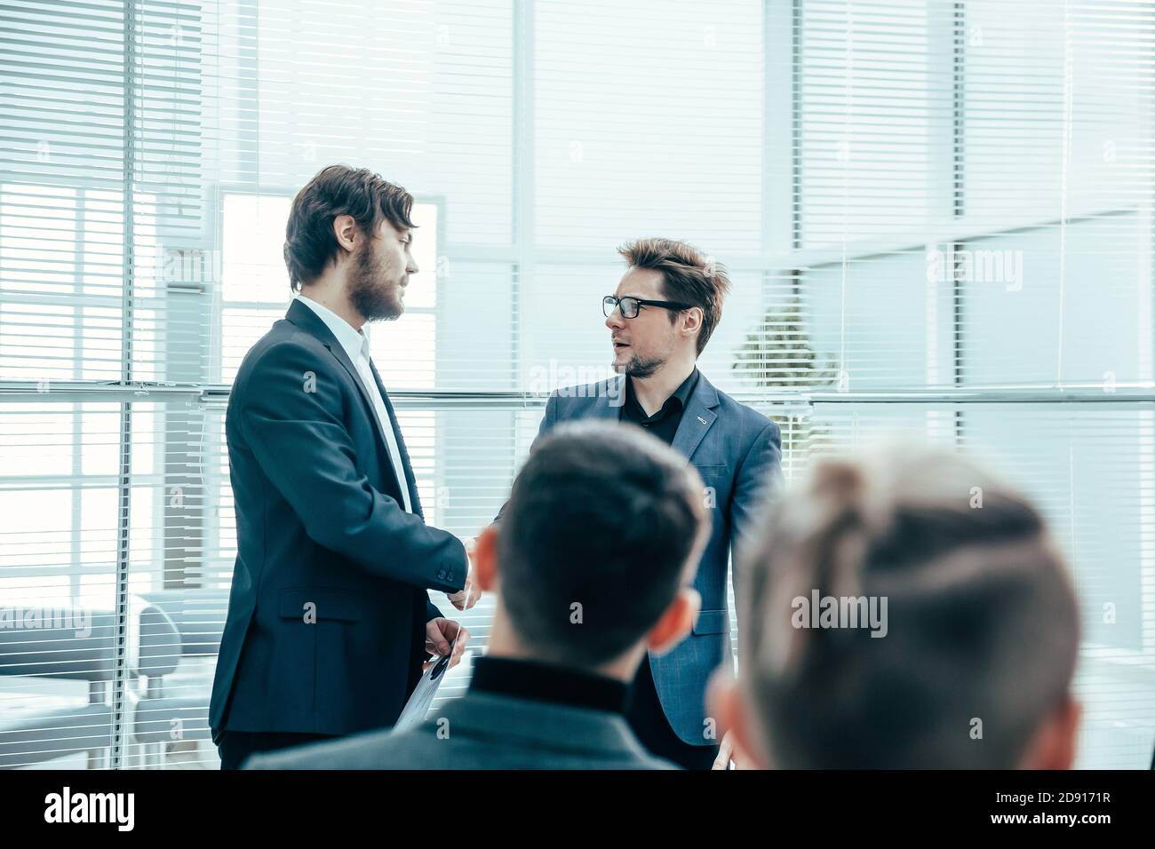 business colleagues shaking hands with each other . Stock Photo
