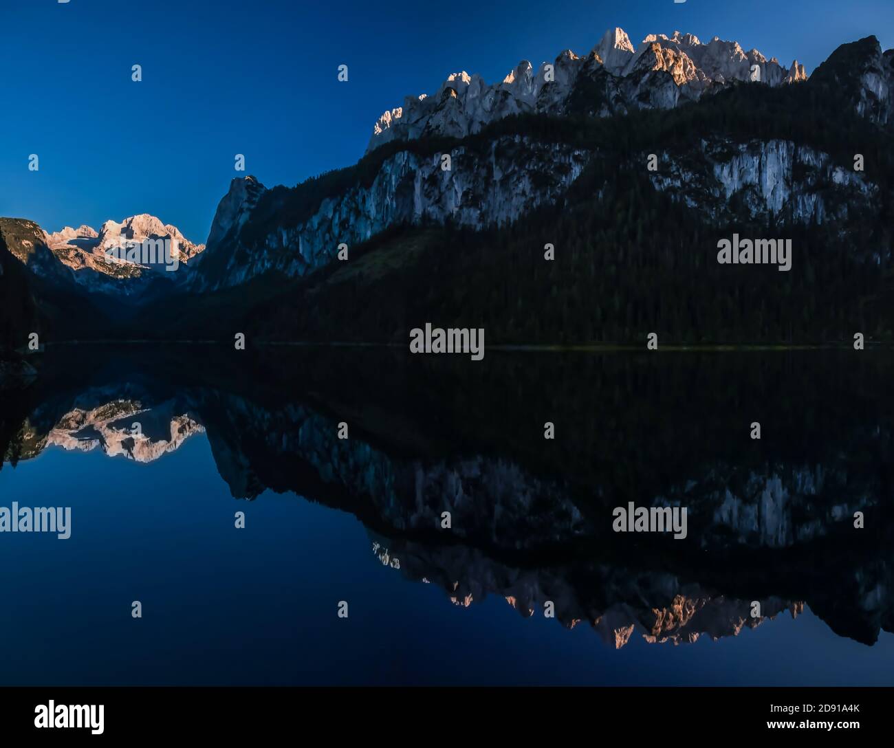 Perfect reflection of Dachstein in Gosausee lake Stock Photo