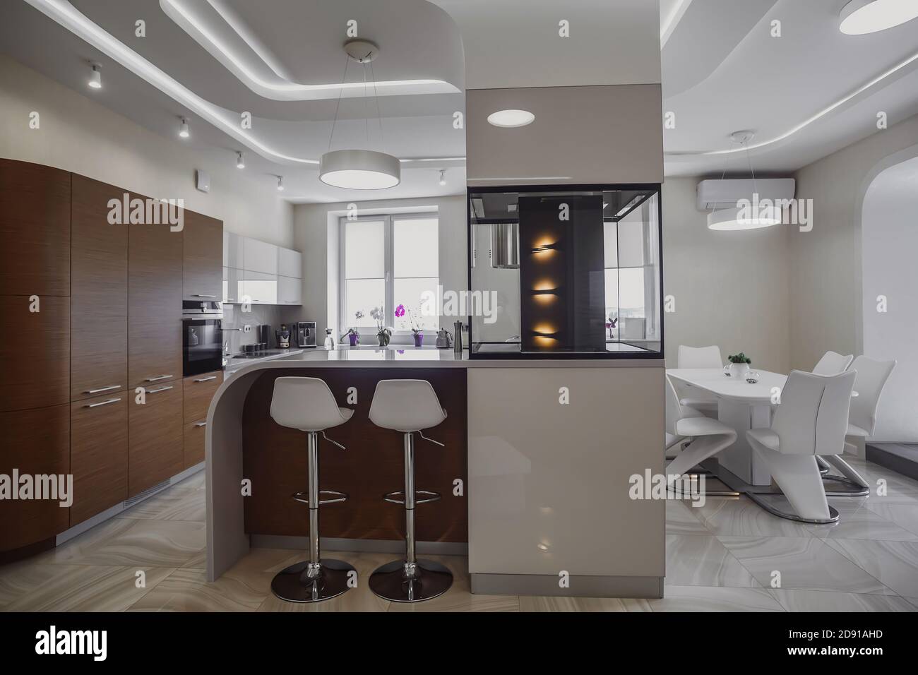 View of luxury expensive modern fitted kitchen with stainless steel