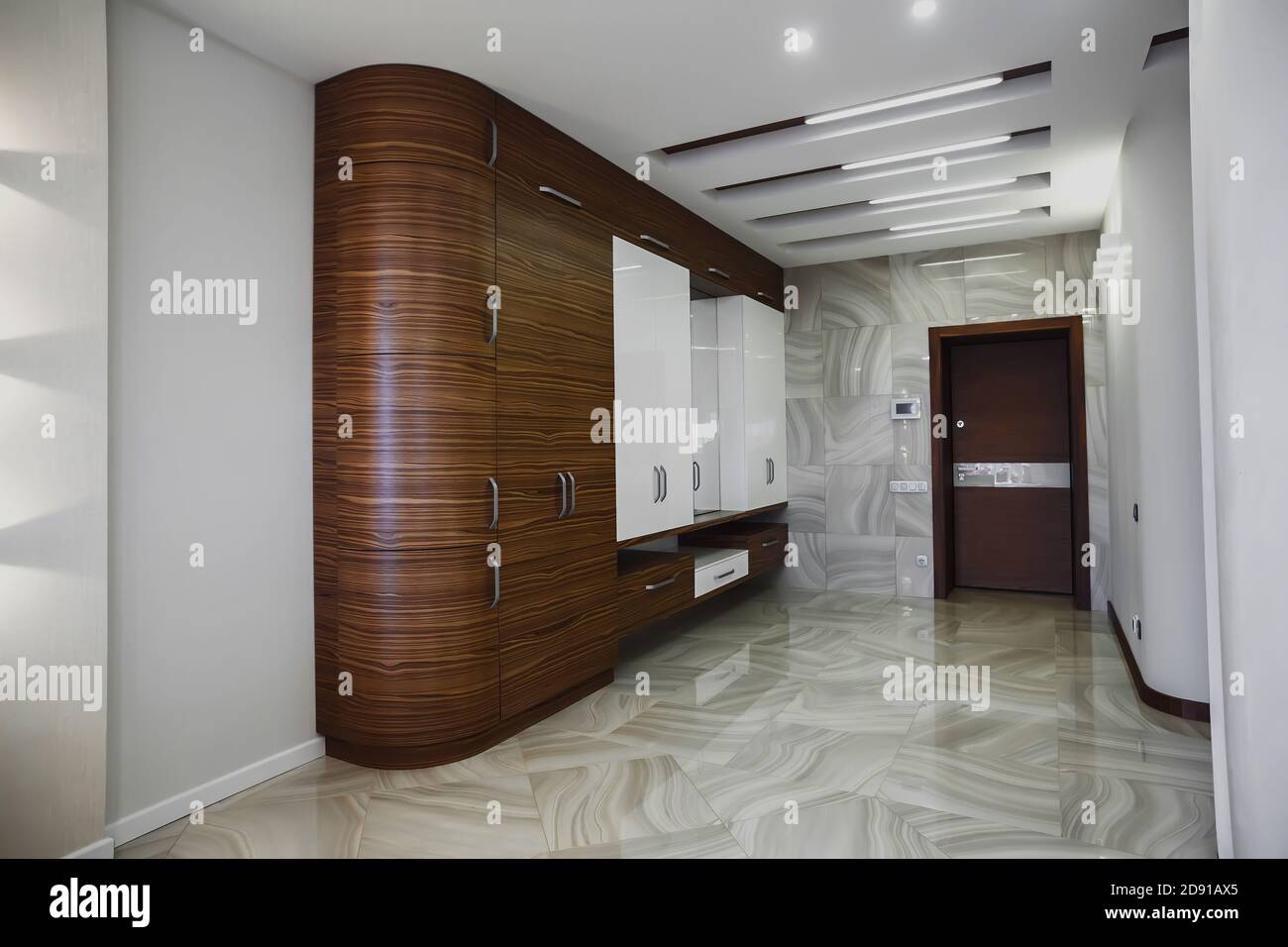 Wooden cabinet in modern hallway interior with luxury marble floor Stock Photo