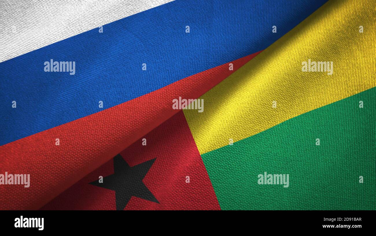 Russia and Guinea-Bissau two flags textile cloth, fabric texture Stock Photo
