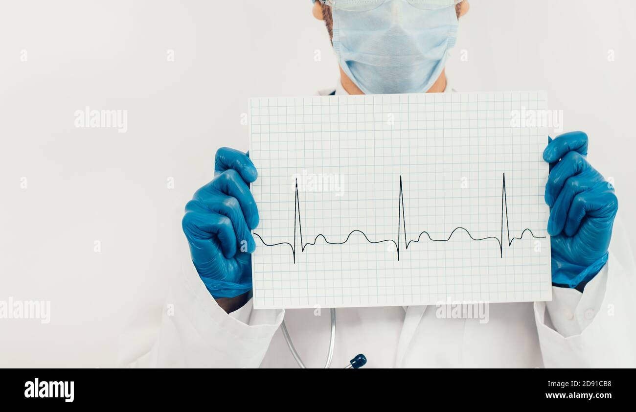sheet with a cardiogram in the hands of a doctor Stock Photo - Alamy