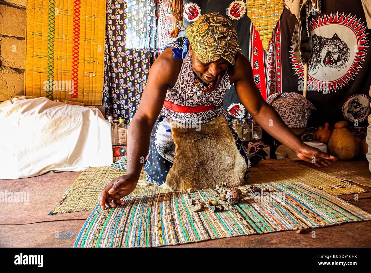 Sabi Sabi, South Africa - May 5, 2012: African Male Traditional Healer known as a Sangoma or witch-doctor performing a spiritual reading Stock Photo