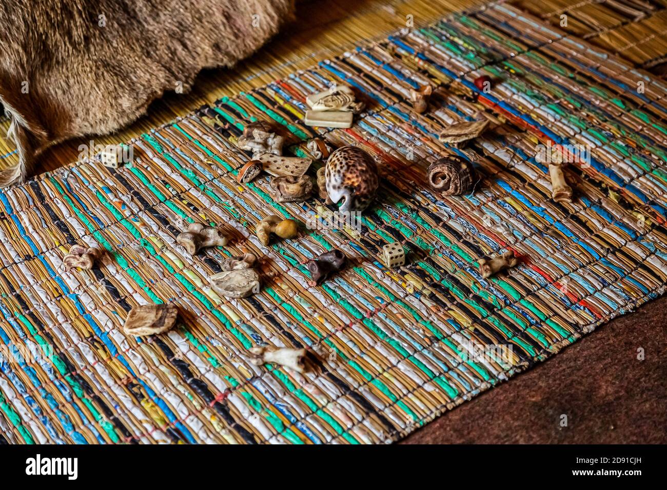 Sabi Sabi, South Africa - May 5, 2012: Traditional Healer known as a Sangoma or witch-doctor performing a spiritual reading with bones and shells Stock Photo