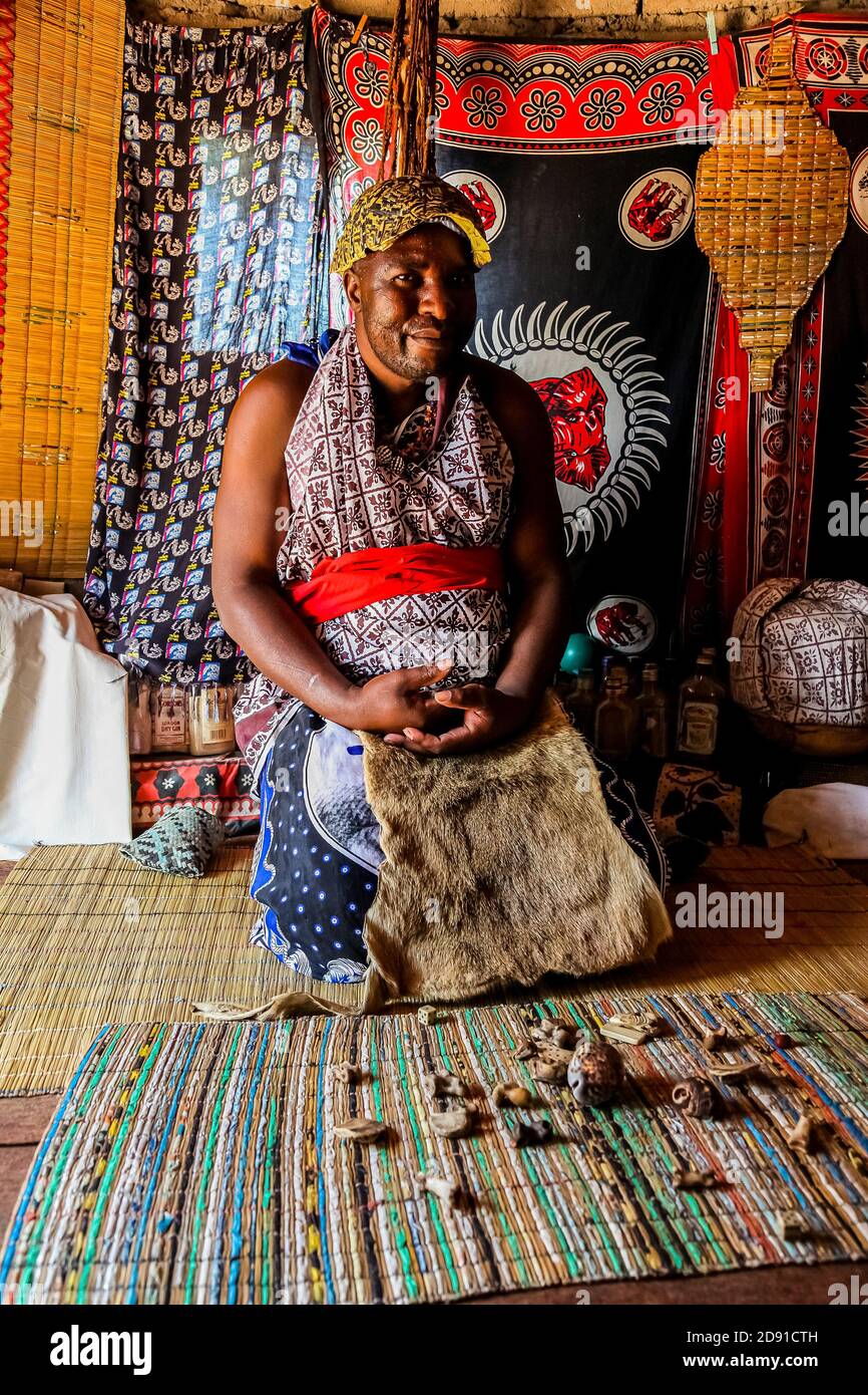 Sabi Sabi, South Africa - May 5, 2012: African Male Traditional Healer known as a Sangoma or witch-doctor performing a spiritual reading Stock Photo