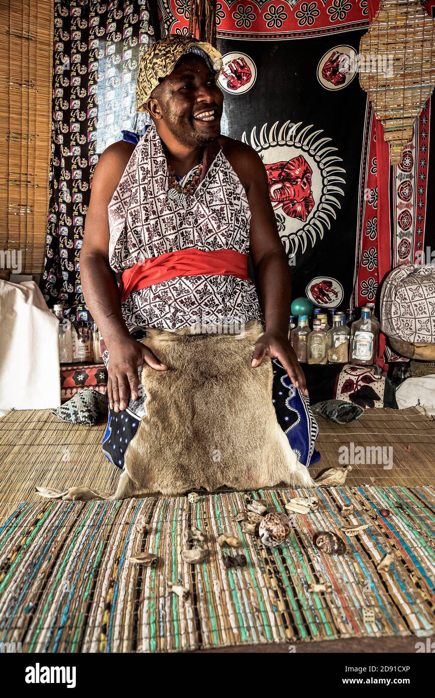 Sabi Sabi, South Africa - May 5, 2012: African Male Traditional Healer known as a Sangoma or witch-doctor performing a spiritual reading Stock Photo