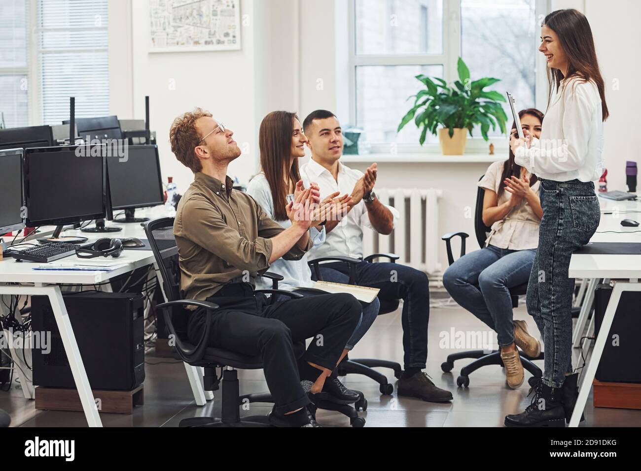 Young business people celebrating success in the modern office Stock ...