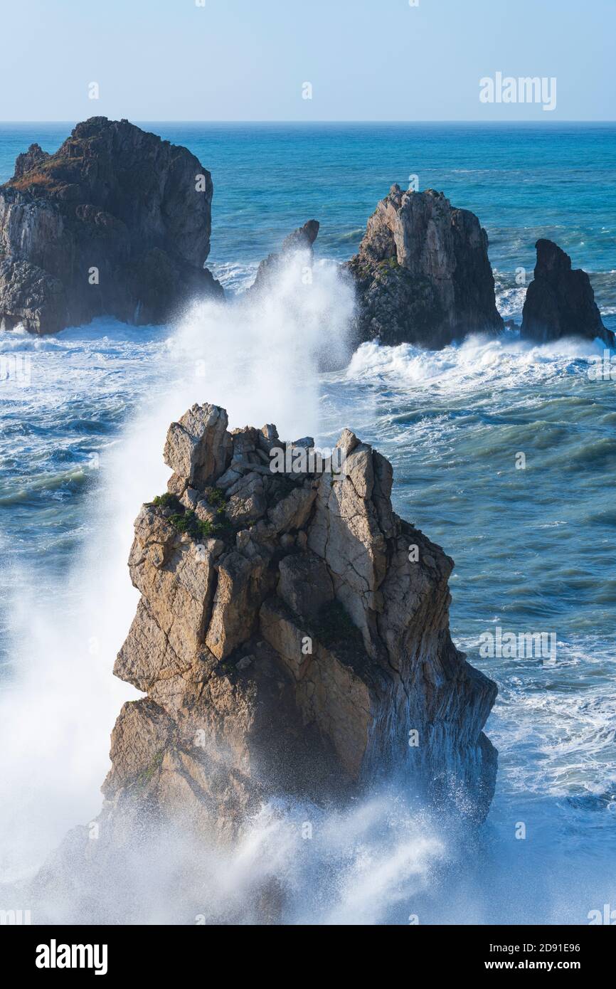 Dusk and waves in the Cantabrian Sea in the surroundings of Costa Quebrada in the Los Urros de Liencres area in the Municipality of Piélagos in the Au Stock Photo