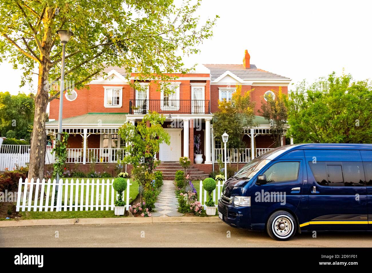 Johannesburg, South Africa - September 10, 2010: Minibus taxi van parked outside a house in a wealthy neighborhood Stock Photo