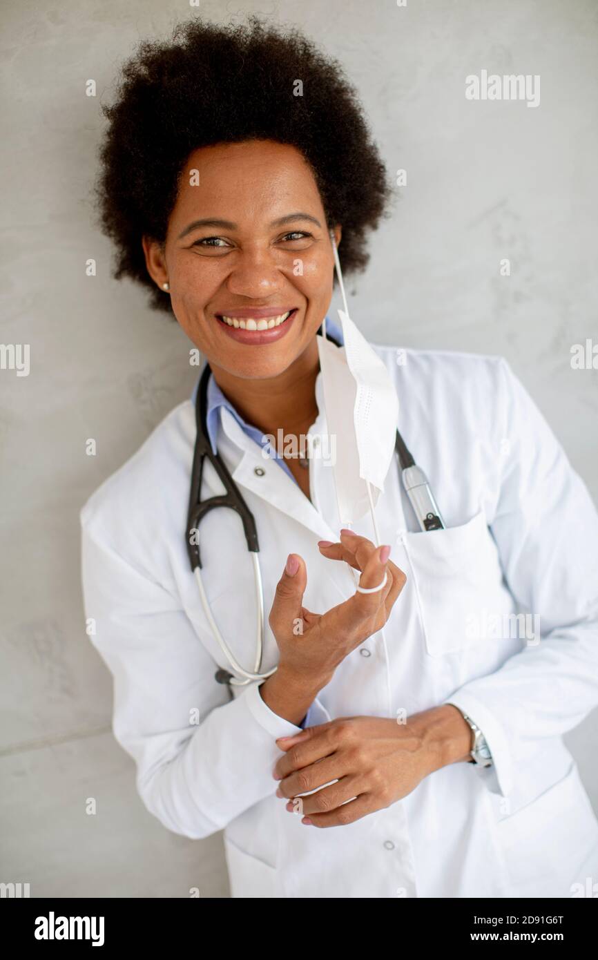 African woman taking off covid hi-res stock photography and images - Alamy