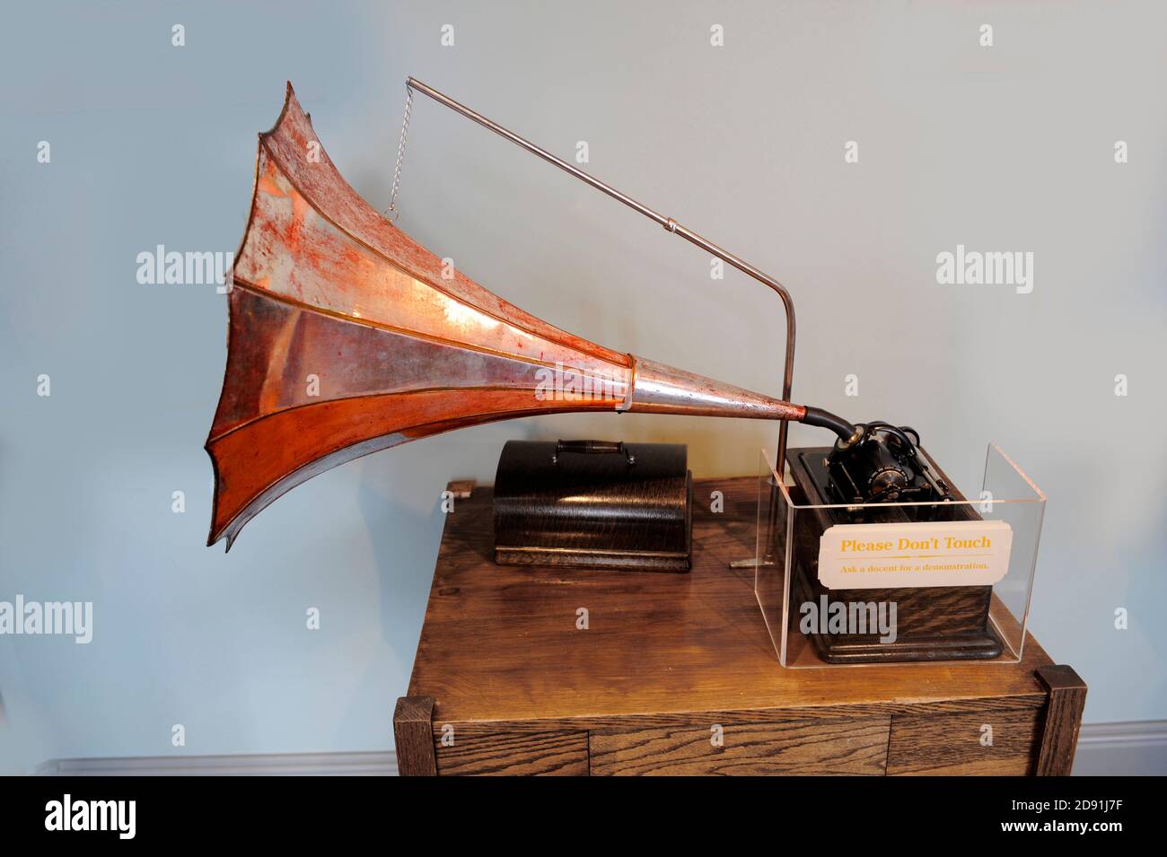 Early phonograph or record player invented by Thomas Elva Edison is on display in a museum in his boyhood town of Port Huron Michigan Stock Photo