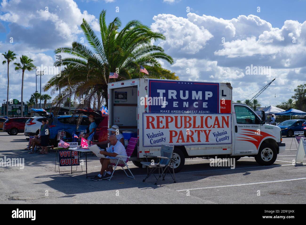 Daytona Beach, USA. 31st Oct, 2020. Trump supporters sit outside a voting station in Daytona Beach. Stock Photo