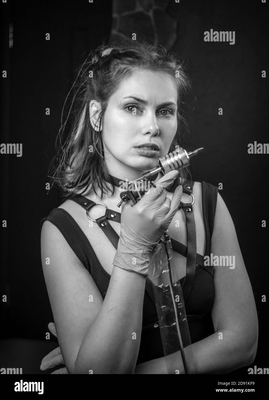 Tattoo artist posing in a tattoo studio Stock Photo Alamy