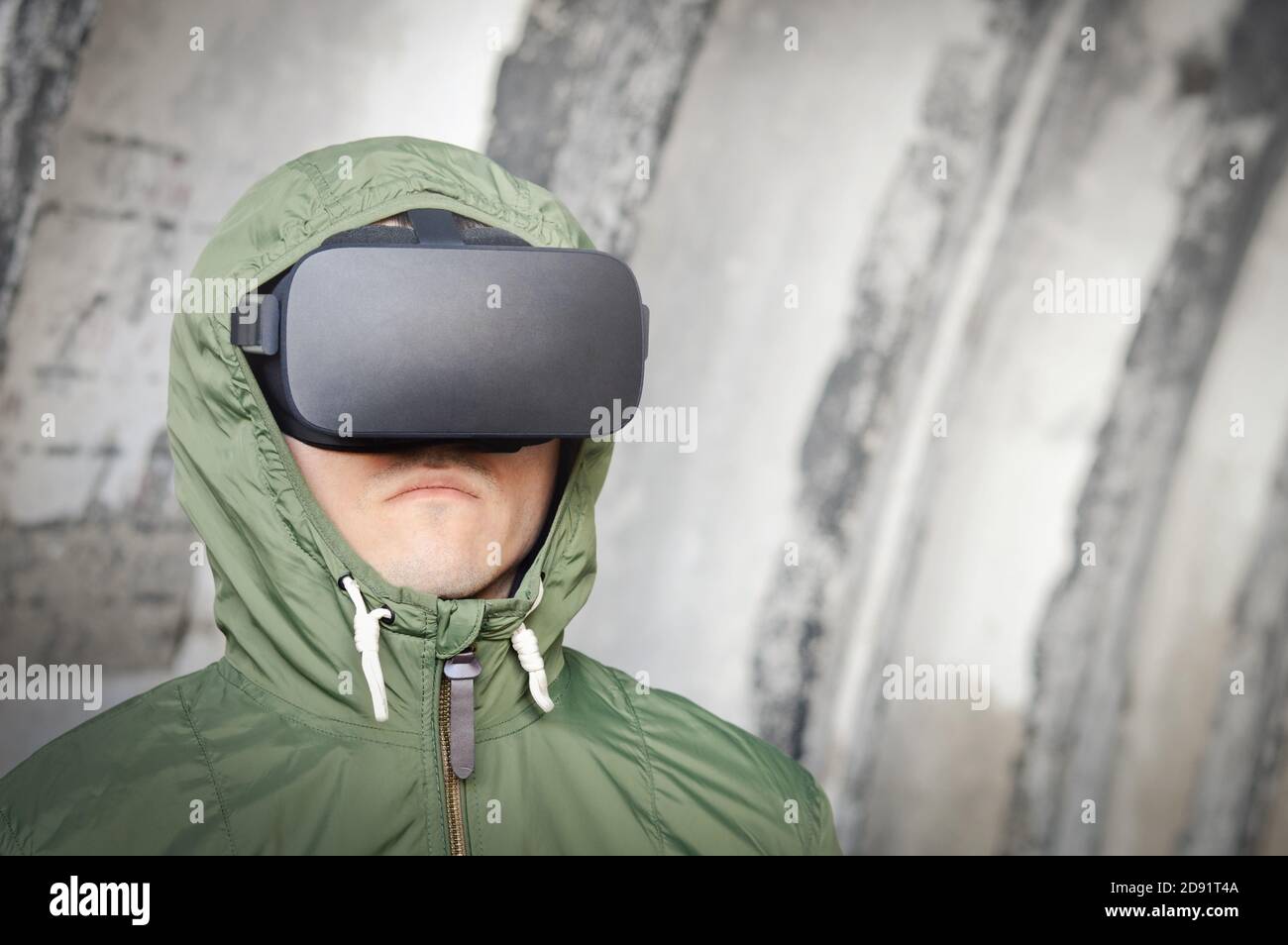 soldier of future with virtual reality headset and a green protective jacket, surveillance, monitoring and military operation Stock Photo