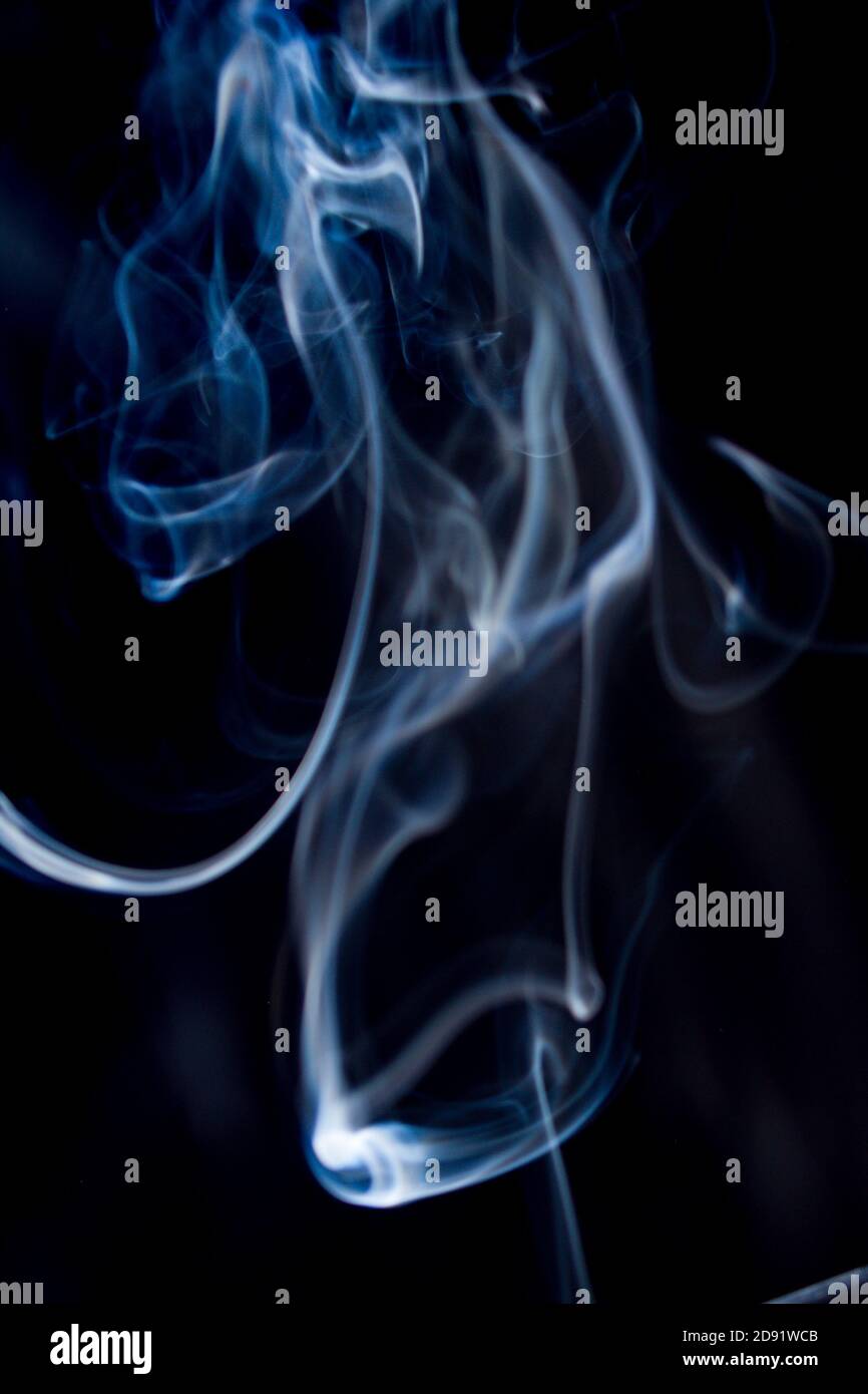 Abstract flowing Blue wispy smoke on dark background Stock Photo