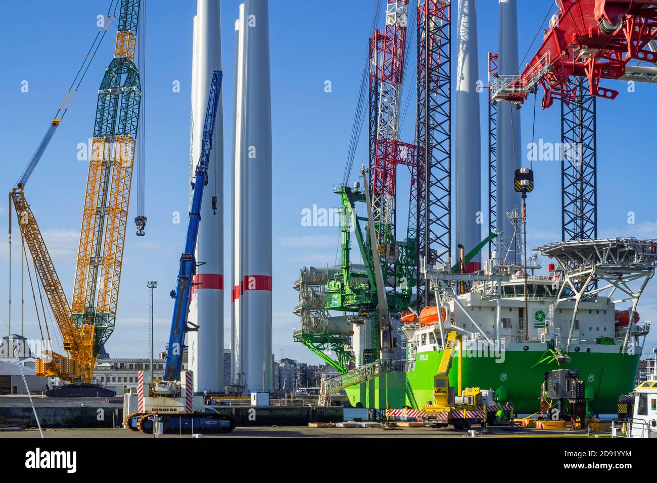 Installation vessel Apollo moored at REBO heavy load terminal in Ostend port, Belgium loading 2 sets of wind turbines for offshore SeaMade wind farm Stock Photo