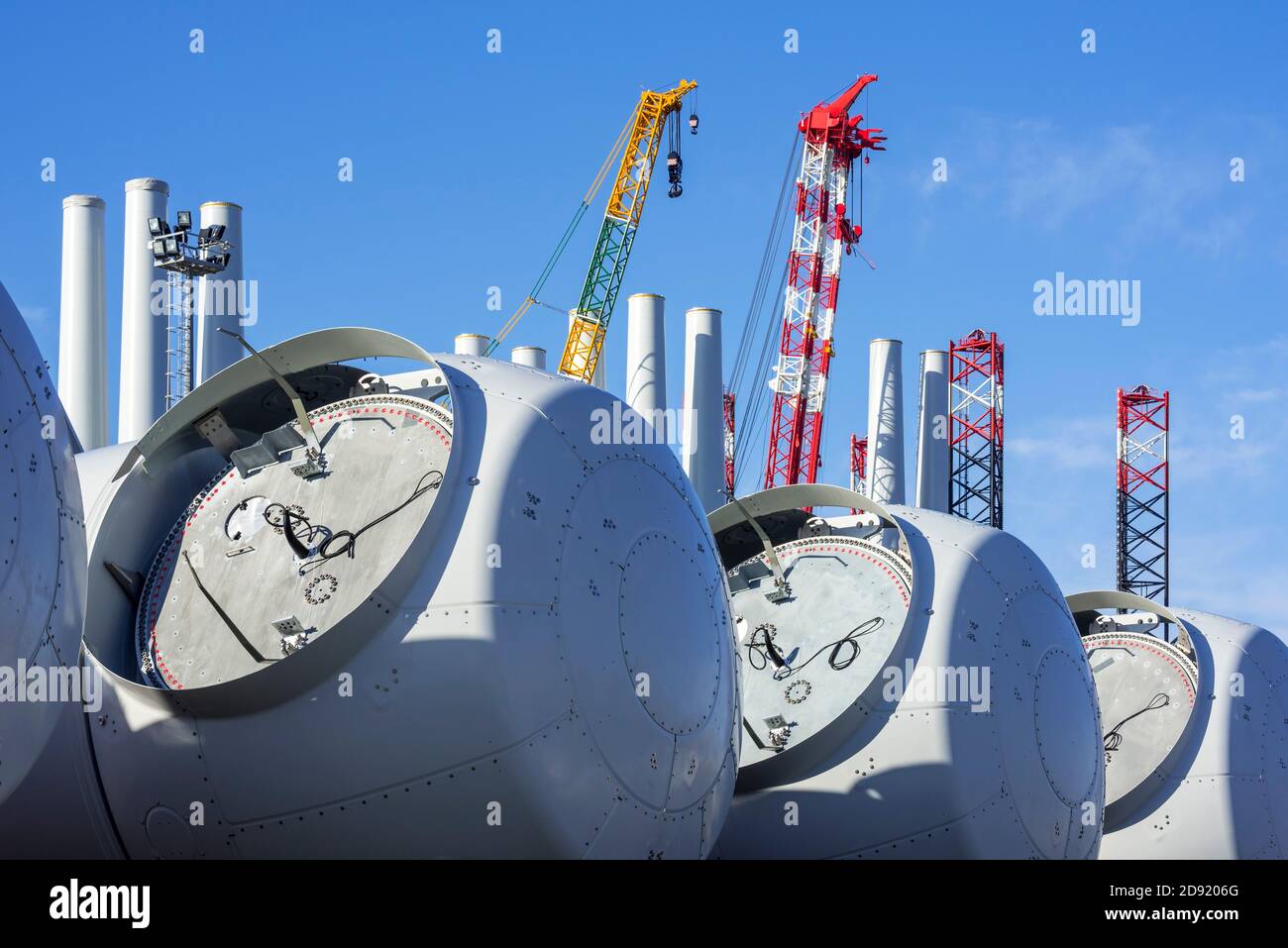 Wind turbine nacelles with rotor hubs for offshore SeaMade wind farm at REBO heavy load terminal in Ostend port, West Flanders, Belgium Stock Photo