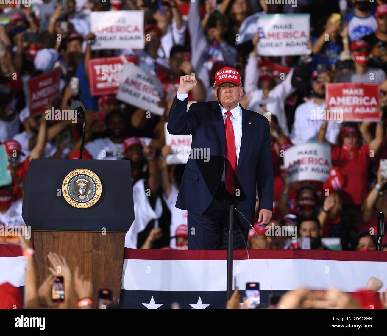 Opa Locka, United States. 01st Nov, 2020. November 1, 2020 - Opa-Locka, Florida, United States - U.S. President Donald Trump gestures to the crowd as he prepares to depart after speaking at a campaign rally at Miami-Opa Locka Executive Airport on November 1, 2020 in Opa-Locka, Florida. President Trump held events in five states today, as he continues his campaign against Democratic presidential nominee Joe Biden two days before the November 3 election. Credit: Paul Hennessy/Alamy Live News Stock Photo