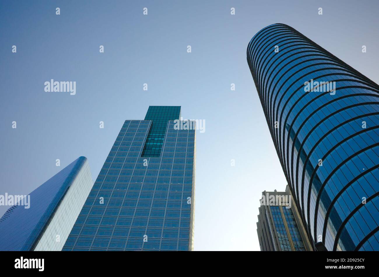 Low angle view of glass and steel building facade of modern office buildings. High rise skyscrapers in Buenos Aires, Argentina. Stock Photo