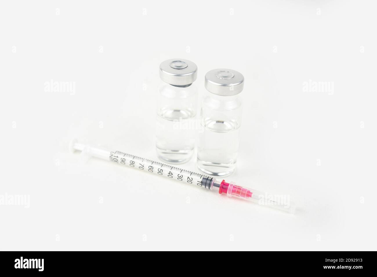 Two vials with medicine and syringe for injection treatment. Covid-19 ...