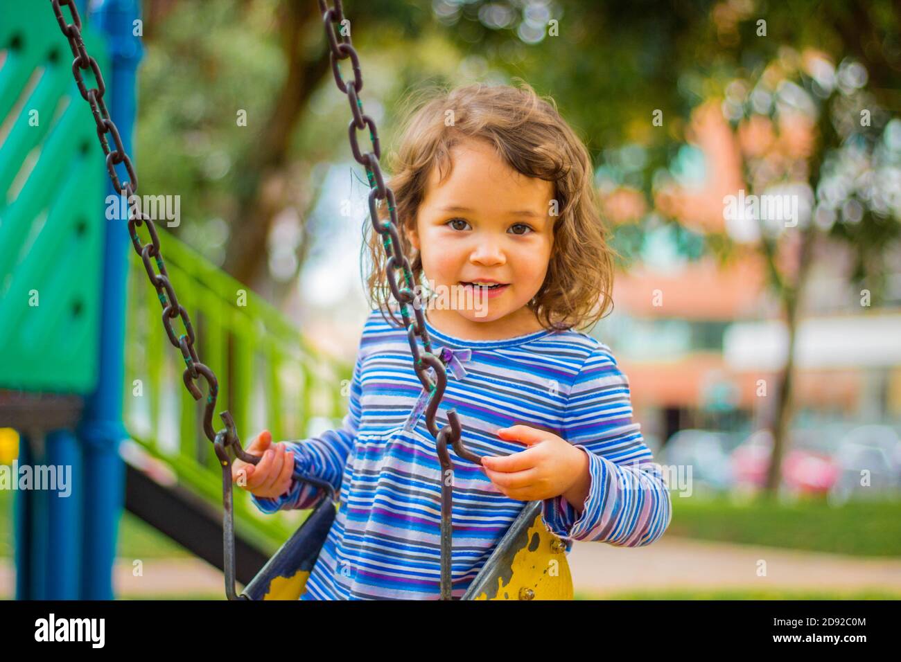 Adorable child smiling and playing in the playground Stock Photo - Alamy