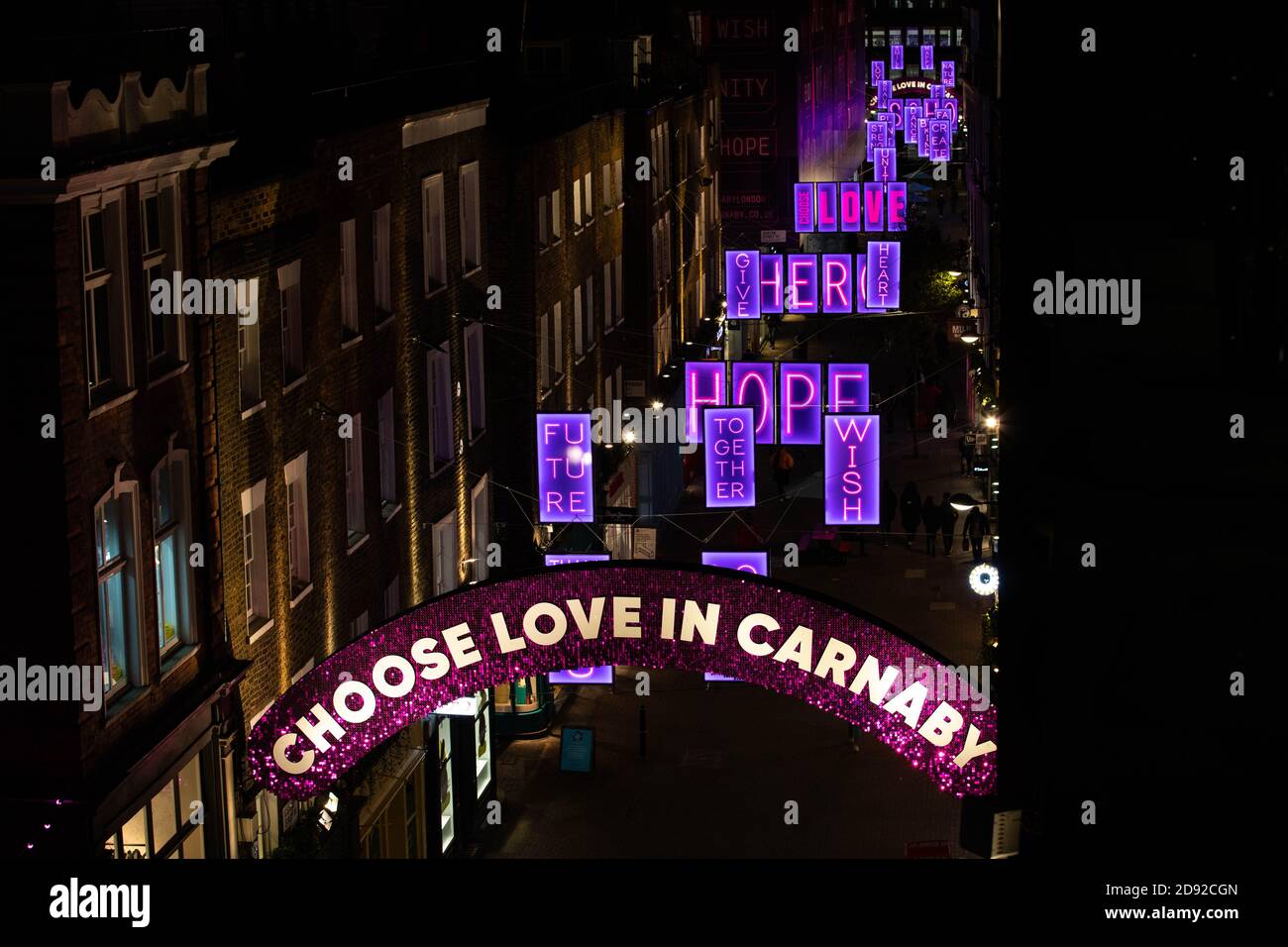 Editorial Use Only The Carnaby Christmas Installation This Year Is Titled Choose Love In Carnaby And Is In Collaboration With Charity Choose Love A Series Of Pink Neon Light Boxes Are Suspended Editorial Use Only The Carnaby Christmas Installation This Year Is Titled Choose Love In Carnaby And Is In Collaboration With Charity Choose Love A Series Of Pink Neon Light Boxes Are Suspended