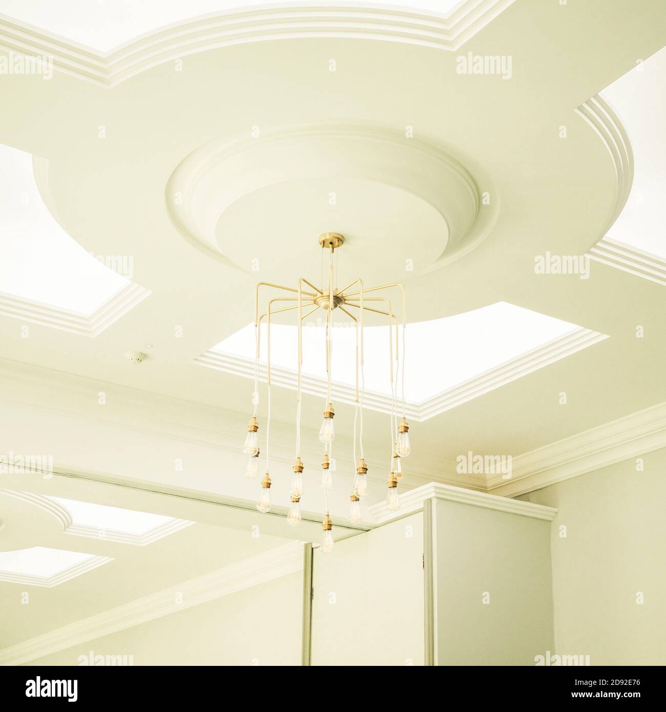 Light bulb chandelier hanging from ceiling Stock Photo