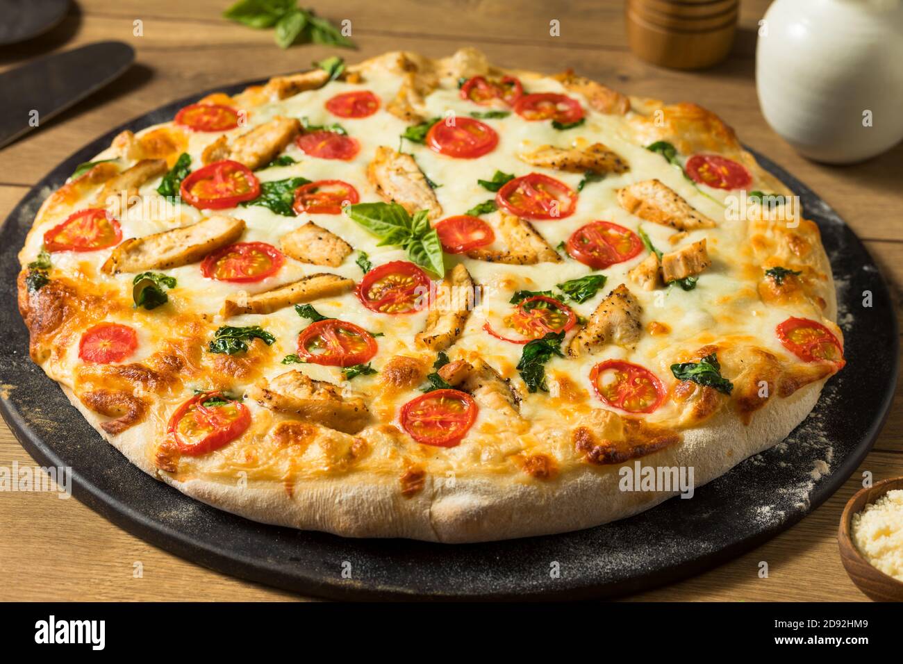 Homemade Chicken Alfredo Pizza with Tomato and Basil Stock Photo Alamy