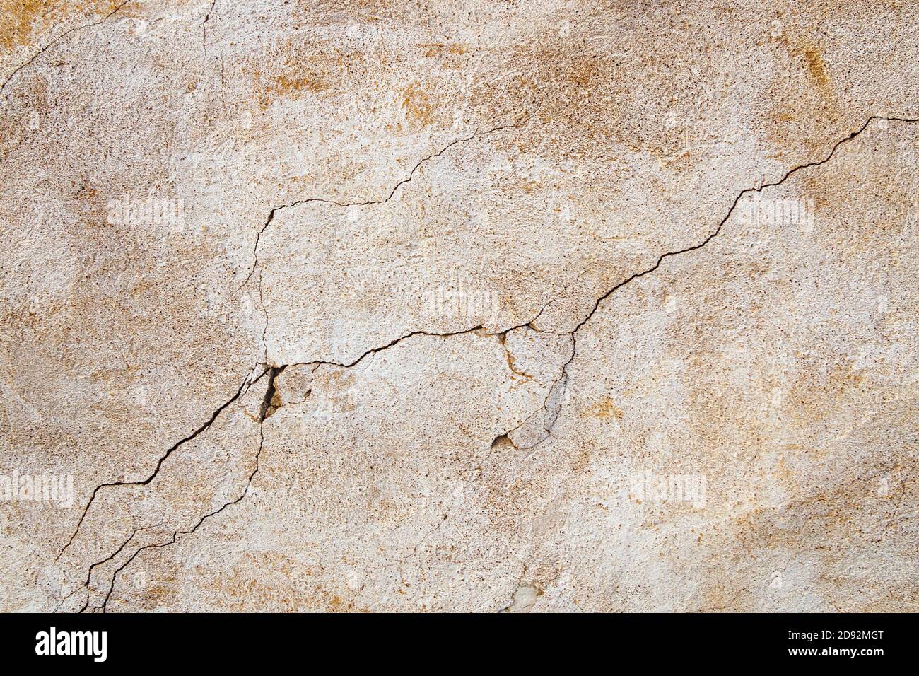 Old cracked concrete wall, weathered building background. Stock Photo
