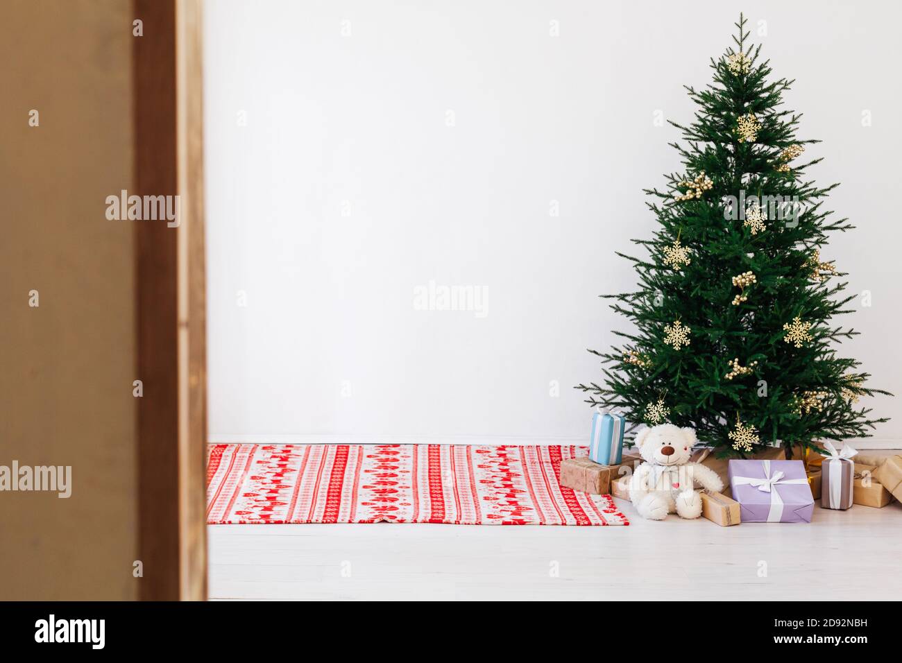Christmas Tree Pine With Gifts For The New Year Of The White Room 2021 2022 Stock Photo - Alamy