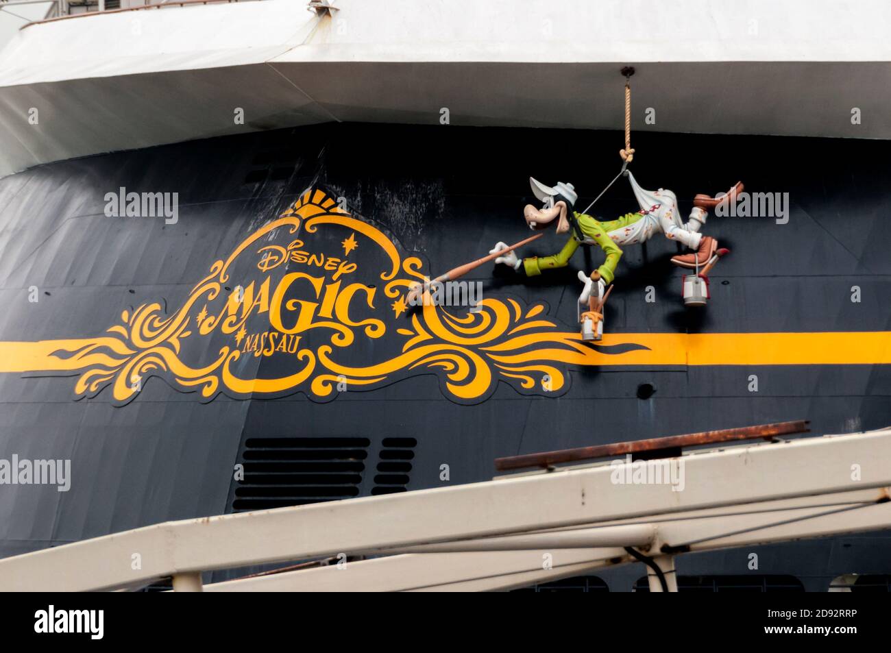 Goofy character painting the ship's name on the stern of the Disney Magic cruise ship. Stock Photo