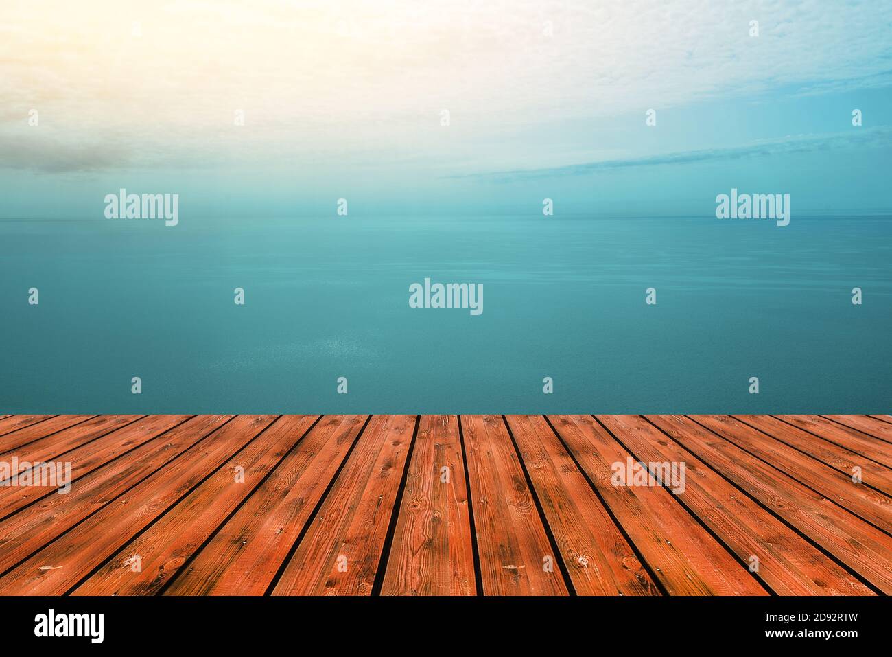 Wooden table top and sea or ocean views with turquoise skies. Display concept of festive background or advertising products. Empty wood table top. Sum Stock Photo