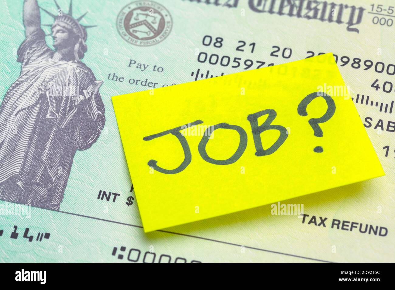 Federal Tax Refund Check with Sticky Note Saying Job Stock Photo