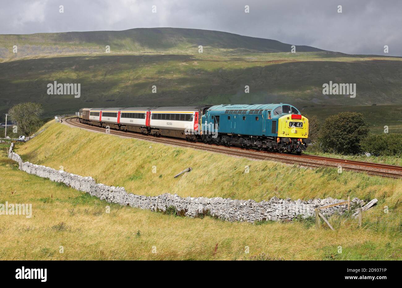 40145 finds a patch of light as it works past Ribblehead on 12.9.20 with the 10.35 Appleby to Skipton. Stock Photo