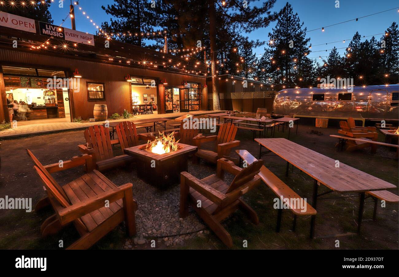 SOUTH LAKE TAHOE, CALIFORNIA, UNITED STATES - Oct 07, 2019: The lawn area at Basecamp Tahoe South Hotel was built to encourage social gathering and re Stock Photo